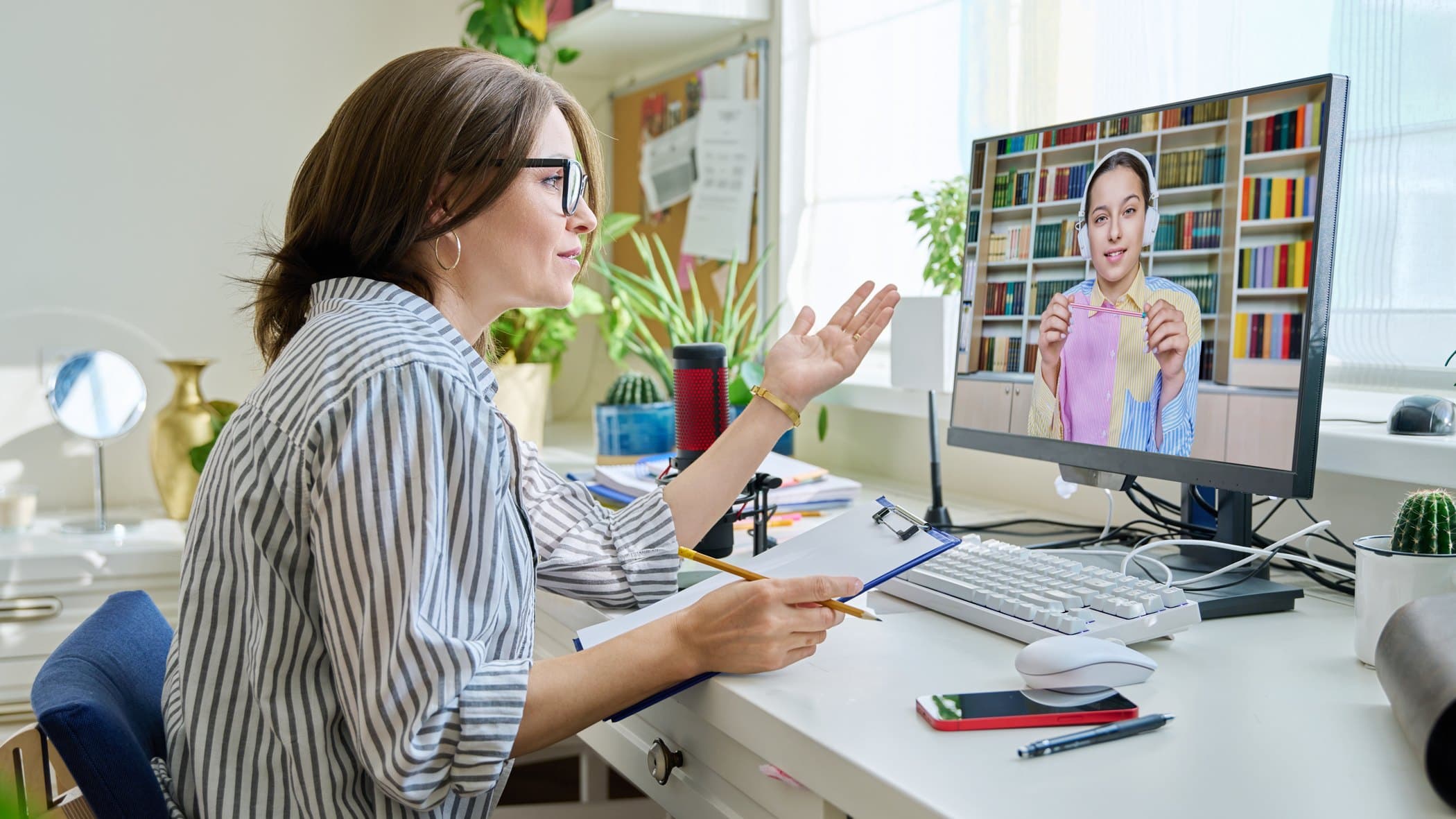 A Richmond teacher leading a one-to-one tutorial, with her pupil joining on screen